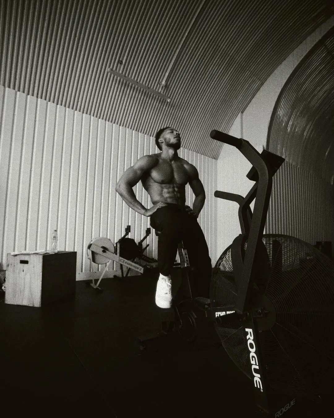 Athlete resting in a quiet gym after training